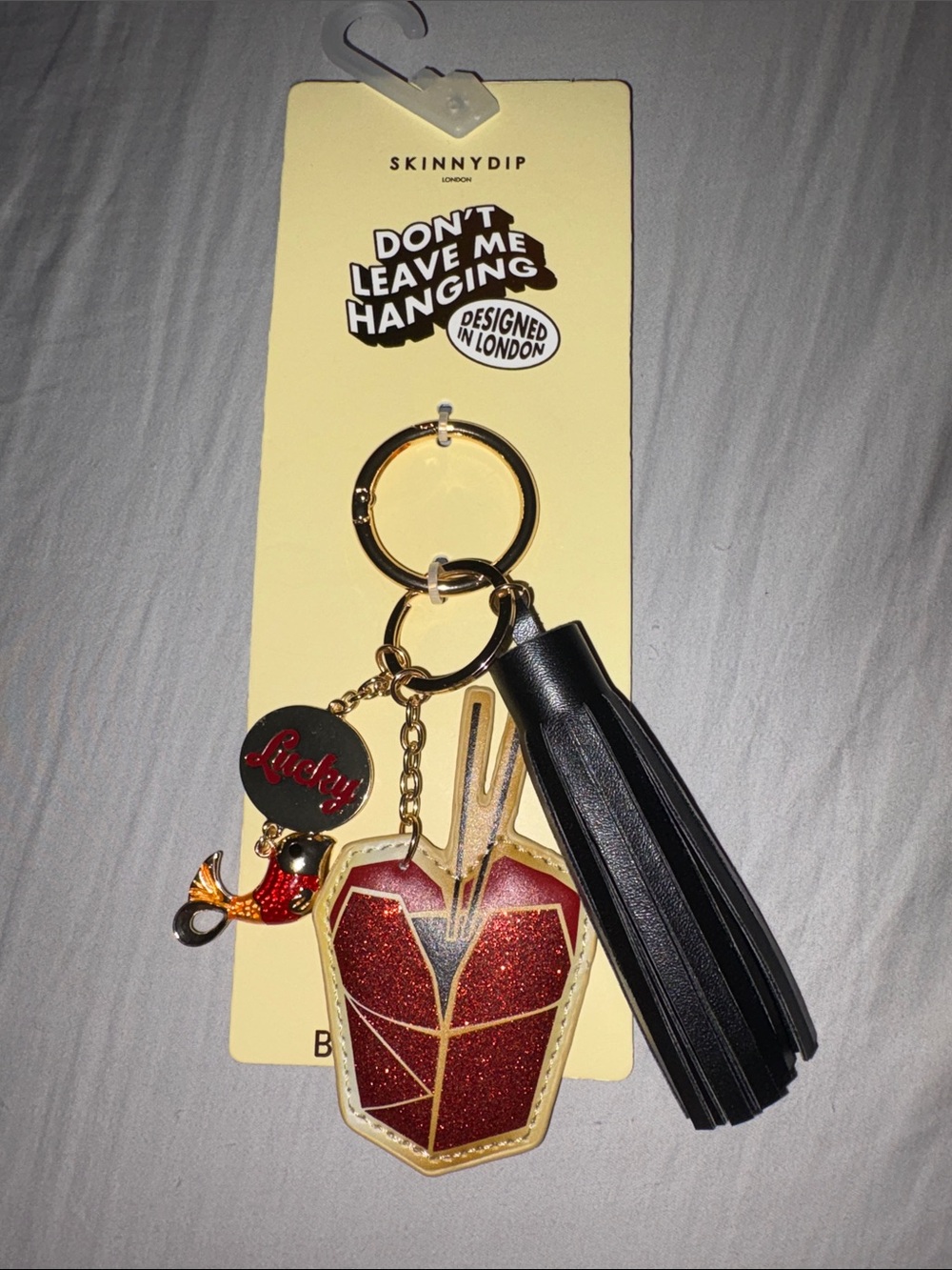 Skinnydip Black Tassel Keyring with Red Glitter Takeout Charm